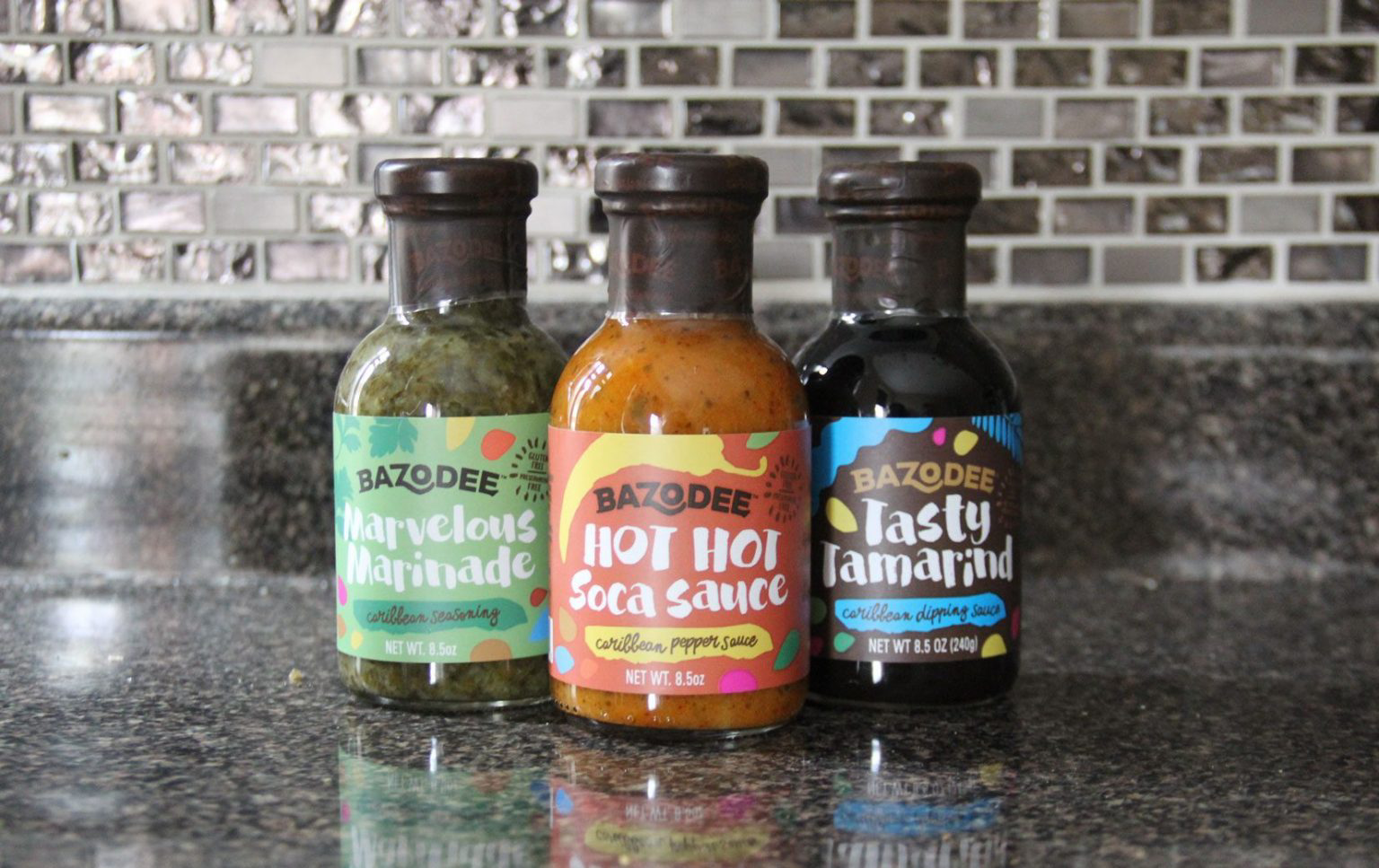Three bottles of Bazodee sauces and marinades.