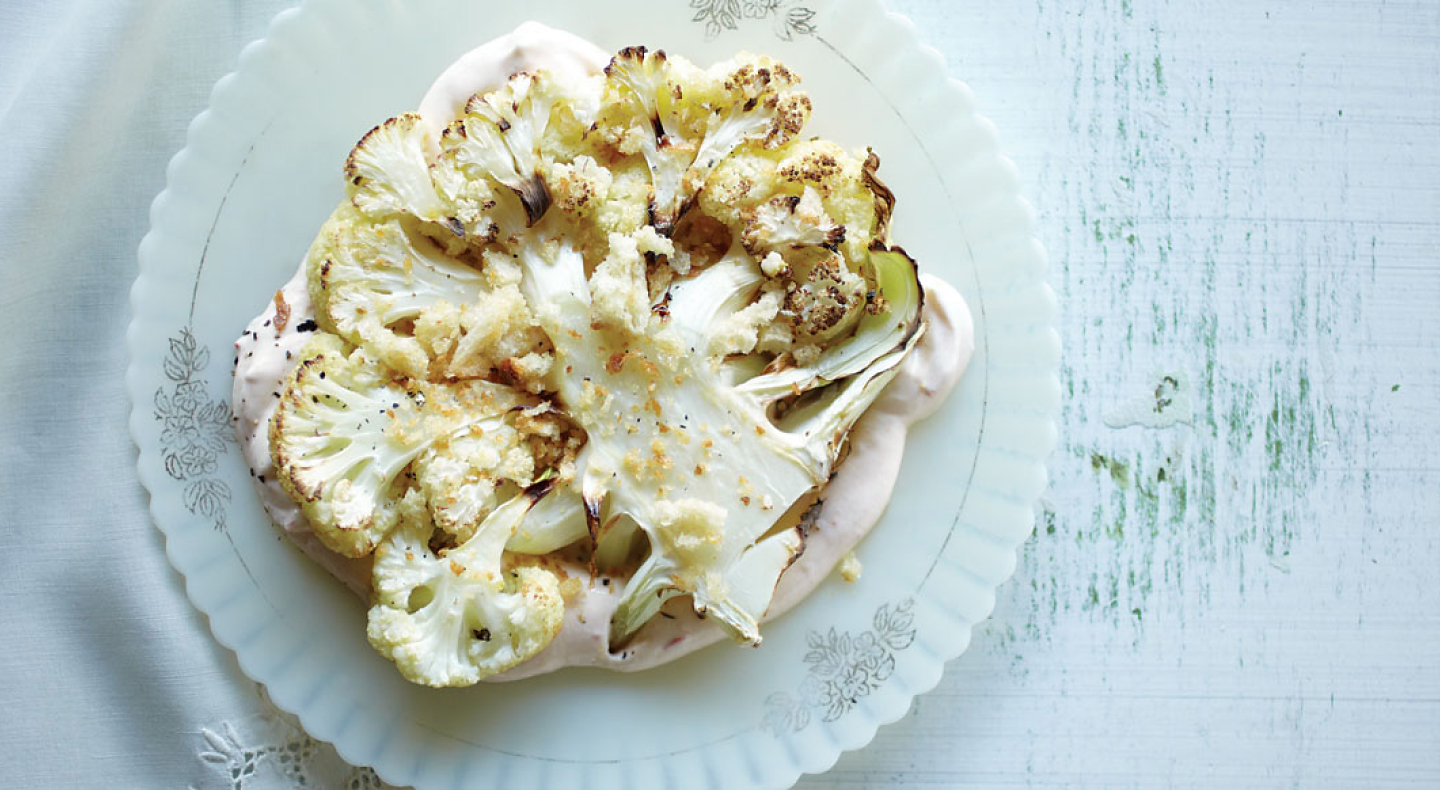 Cooked cauliflower on a serving dish.