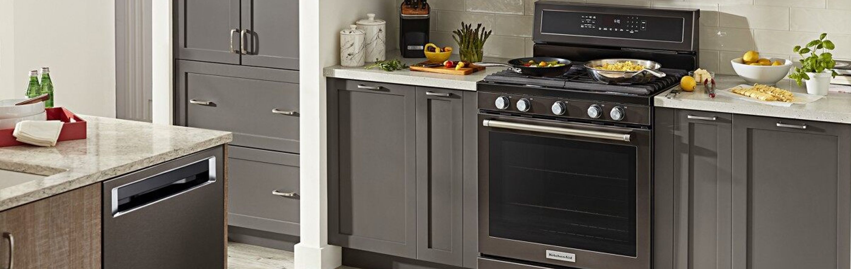 A black stainless steel KitchenAid® freestanding range.