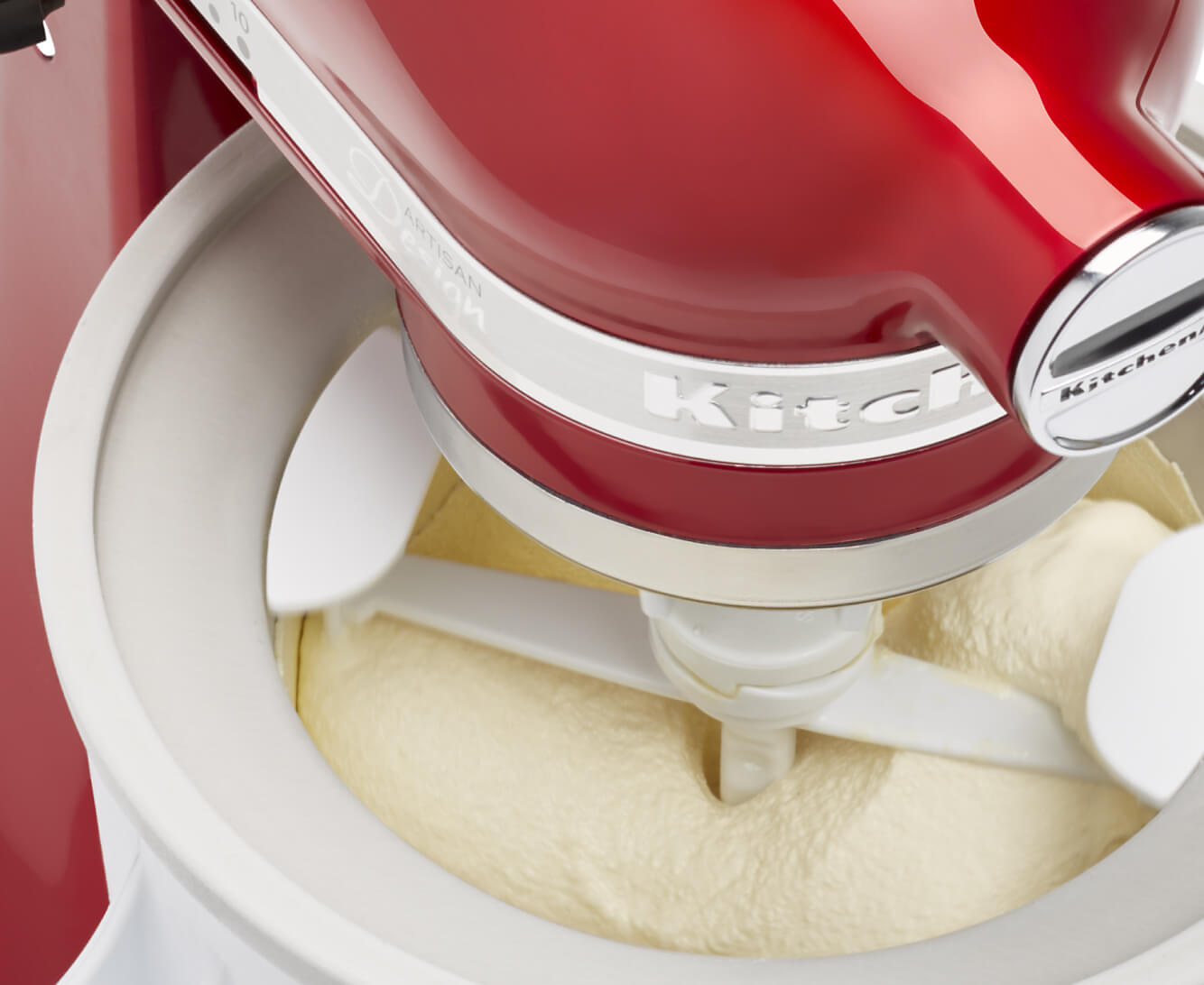 Churning inside a KitchenAid® Ice Cream Maker attachment.