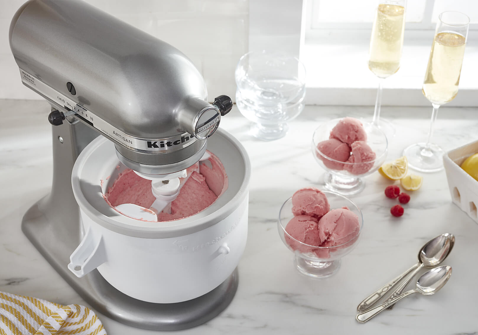 A KitchenAid® stand mixer making raspberry frozen yogurt.