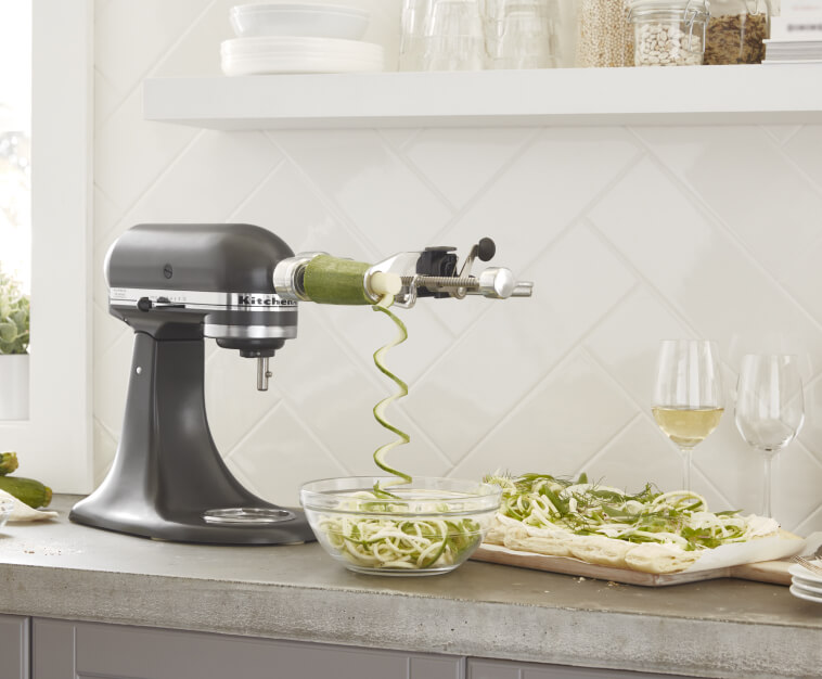 KitchenAid® stand mixer with Spiralizer Attachment spiralizing veggies 