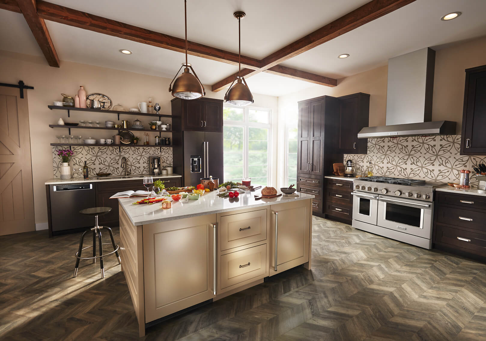 Kitchen with large island and black stainless KitchenAid® appliances.