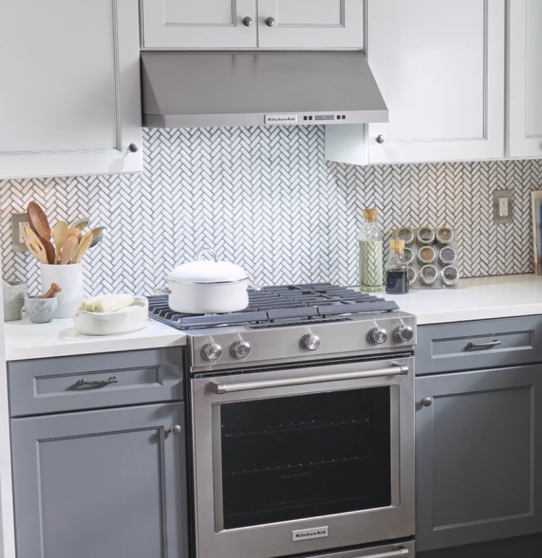 Under-cabinet hood over a gas range