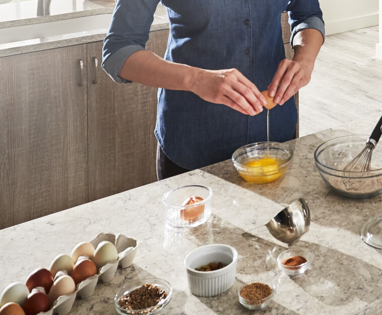 Cracking eggs into a bowl