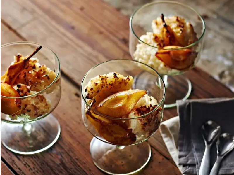 Three glass dishes of rice pudding with caramelized pears