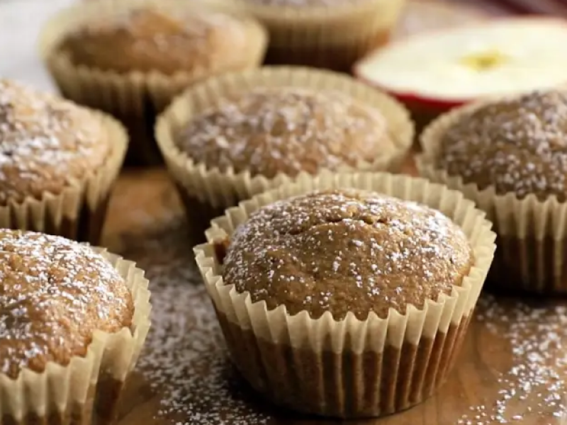 Apple spice muffins dusted with powdered sugar