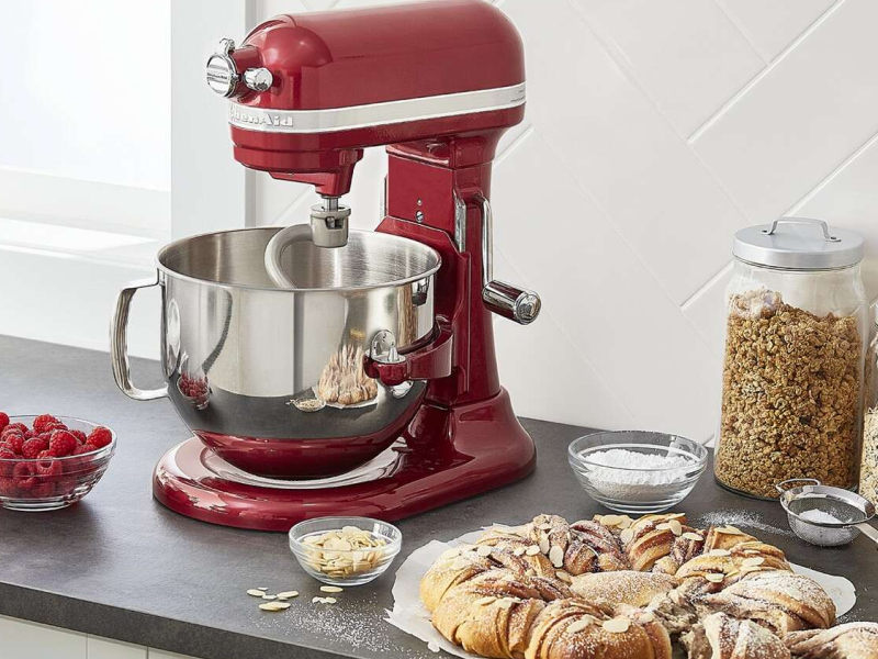 Red KitchenAid® stand mixer next to bread dough
