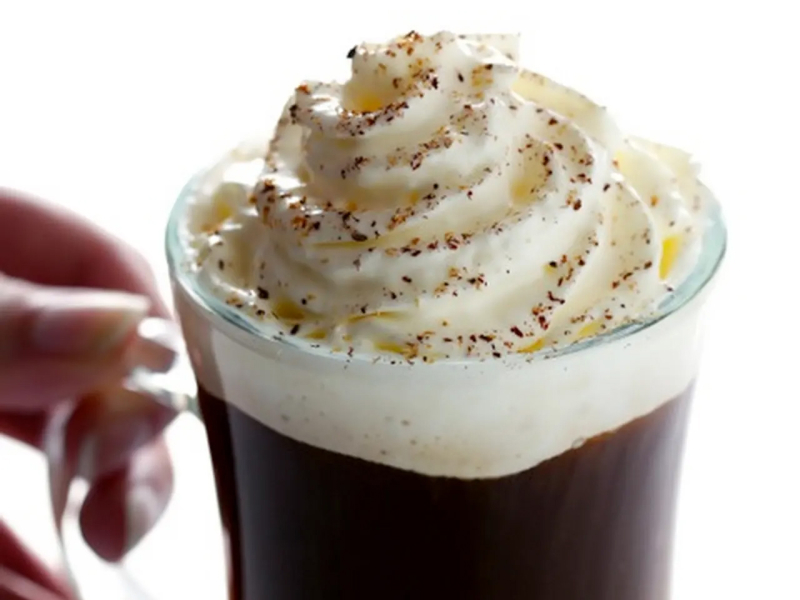 Irish coffee with whipped cream topping