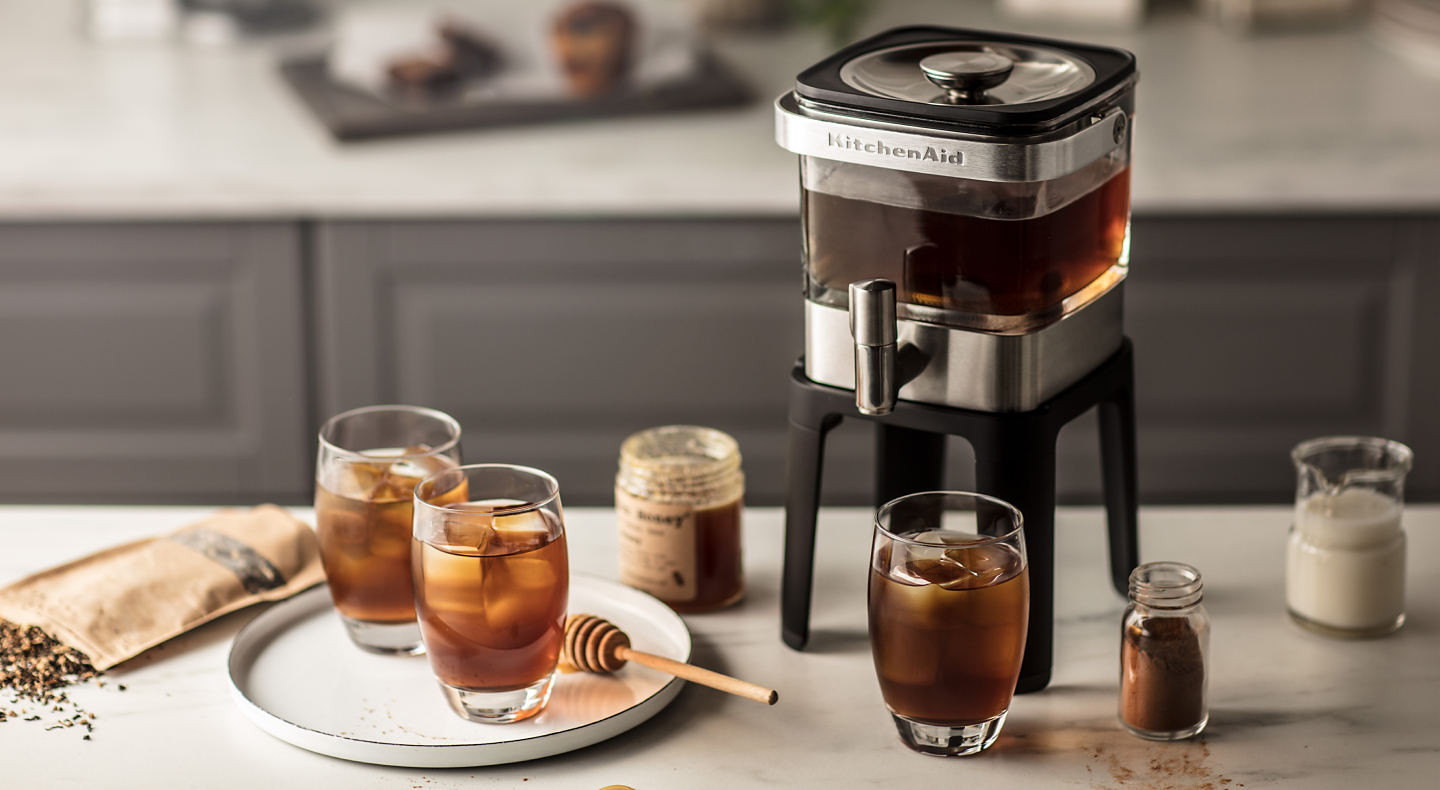 KitchenAid® Cold Brew Coffee Maker with glasses of coffee