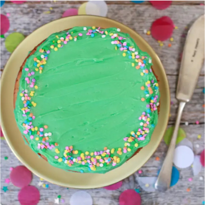 A green mini funfetti cake.