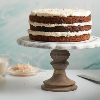 A three-layer carrot cake with cream cheese frosting.