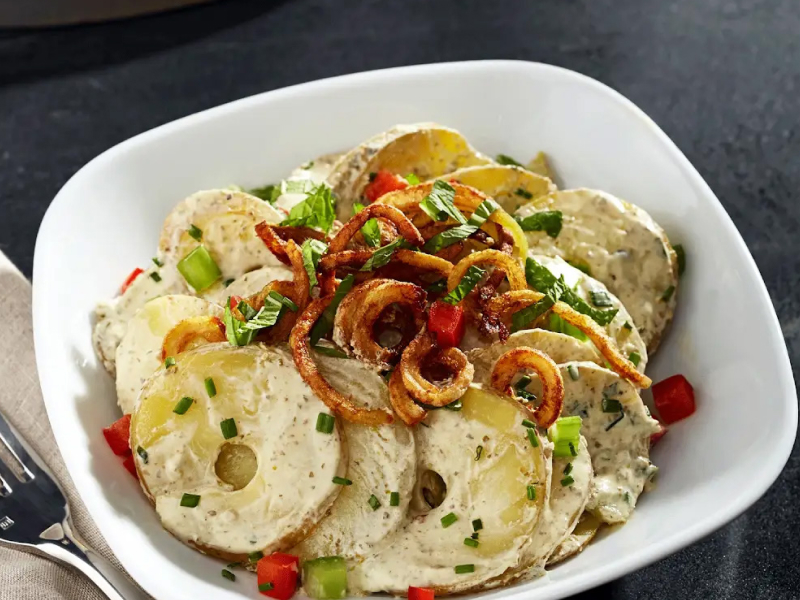 Pesto potato salad in white dish