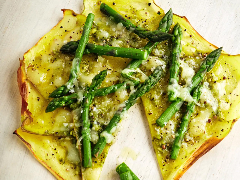 Potato crust pizza topped with asparagus