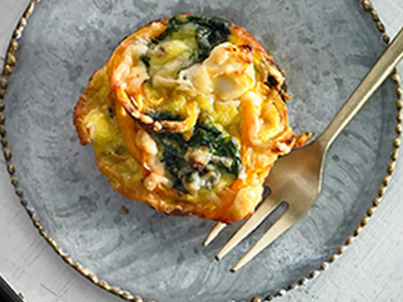 Sweet potato and spinach frittata on blue plate