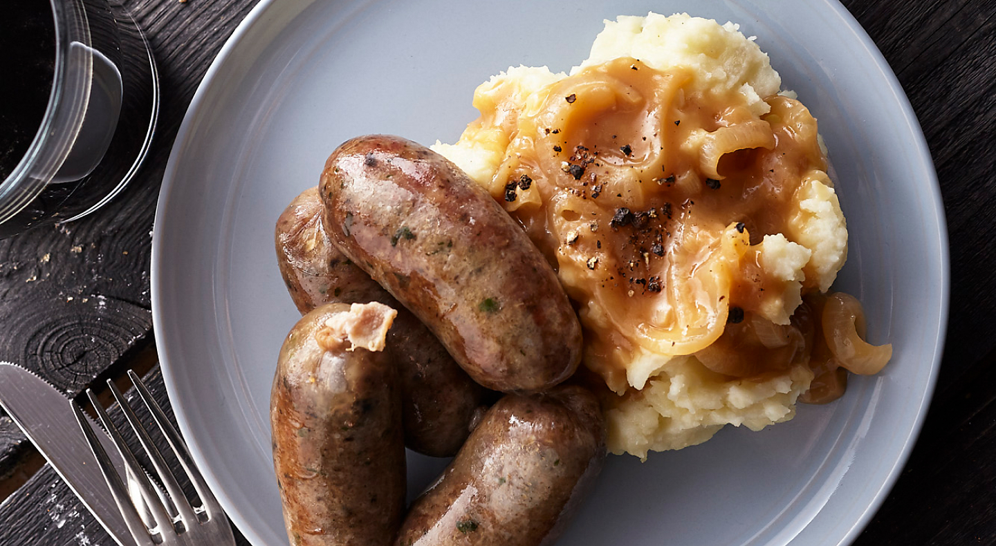 Sausage and mashed potatoes covered with gravy