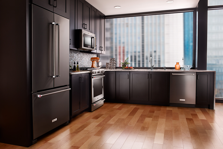Stainless steel KitchenAid® appliances in an L-shaped kitchen
