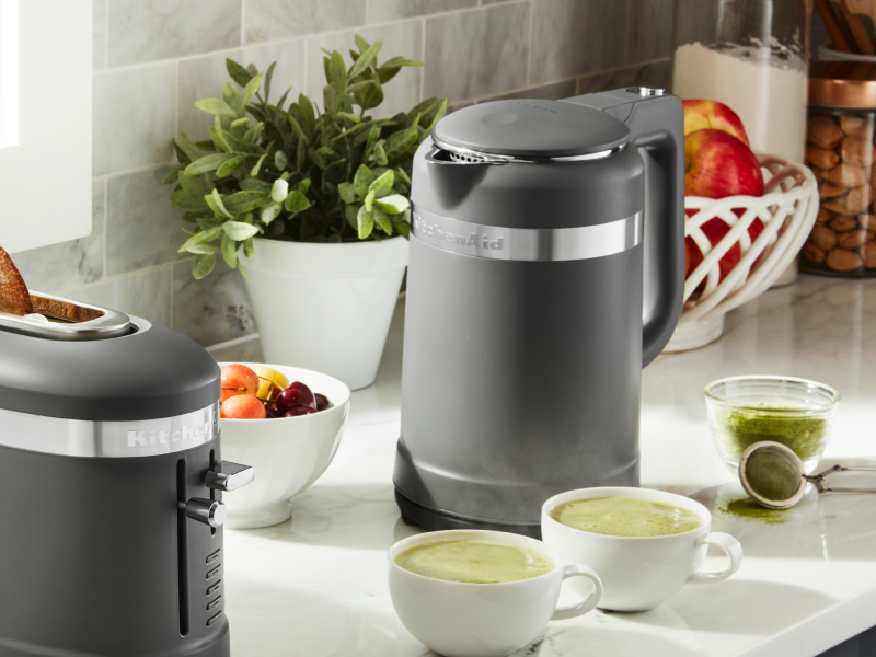 Black KitchenAid® electric kettle next to two cups of matcha
