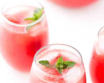 Watermelon sangria in glasses garnished with green leaves