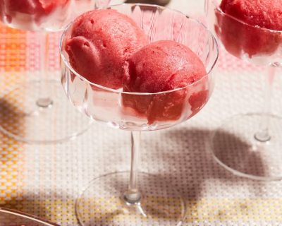 Scoops of sparkling strawberry sorbet in glass dishes
