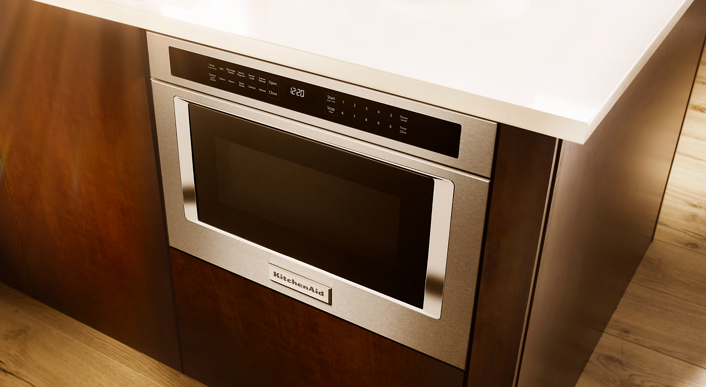 Stainless steel built-in microwave installed in a kitchen island