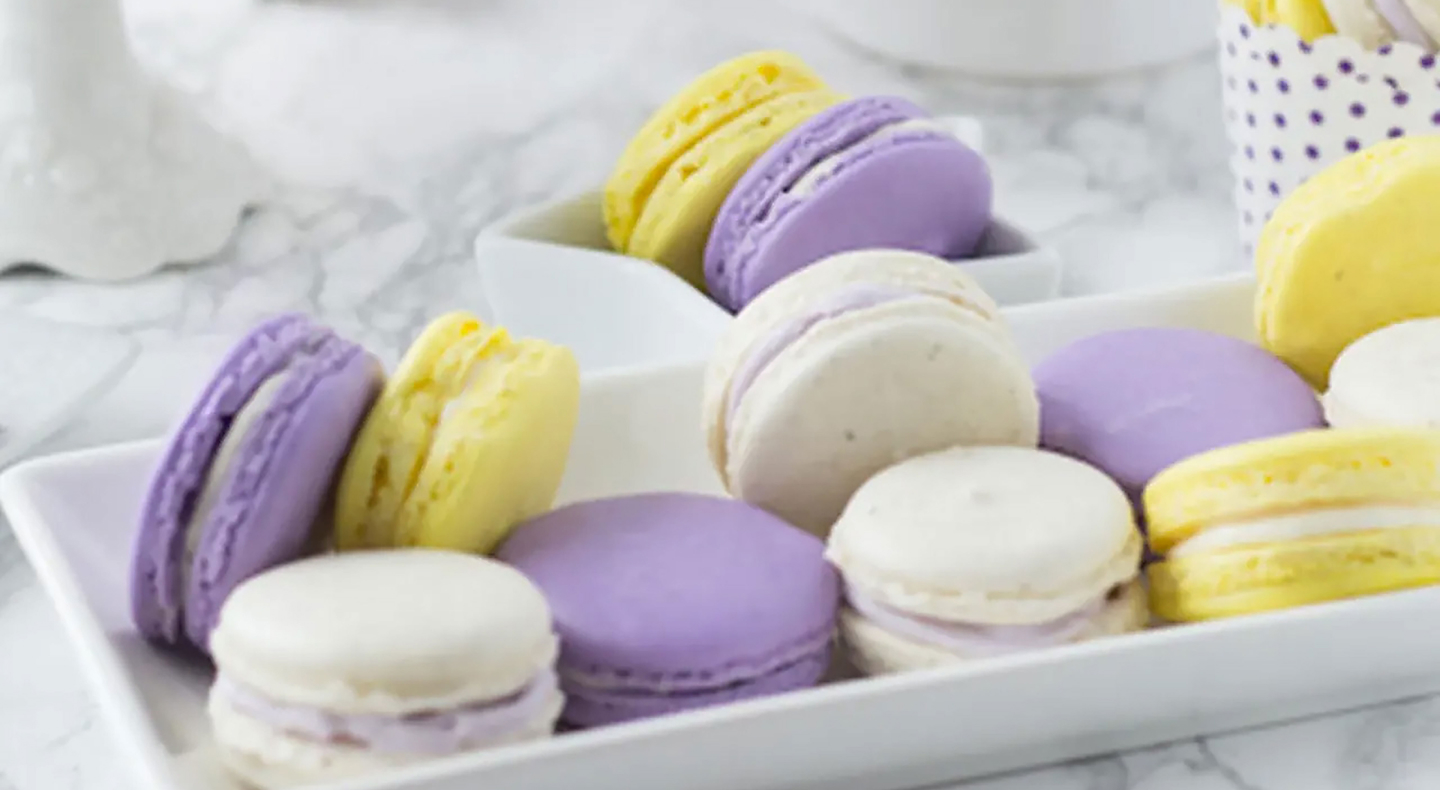Lavender honey macarons on a serving tray. 