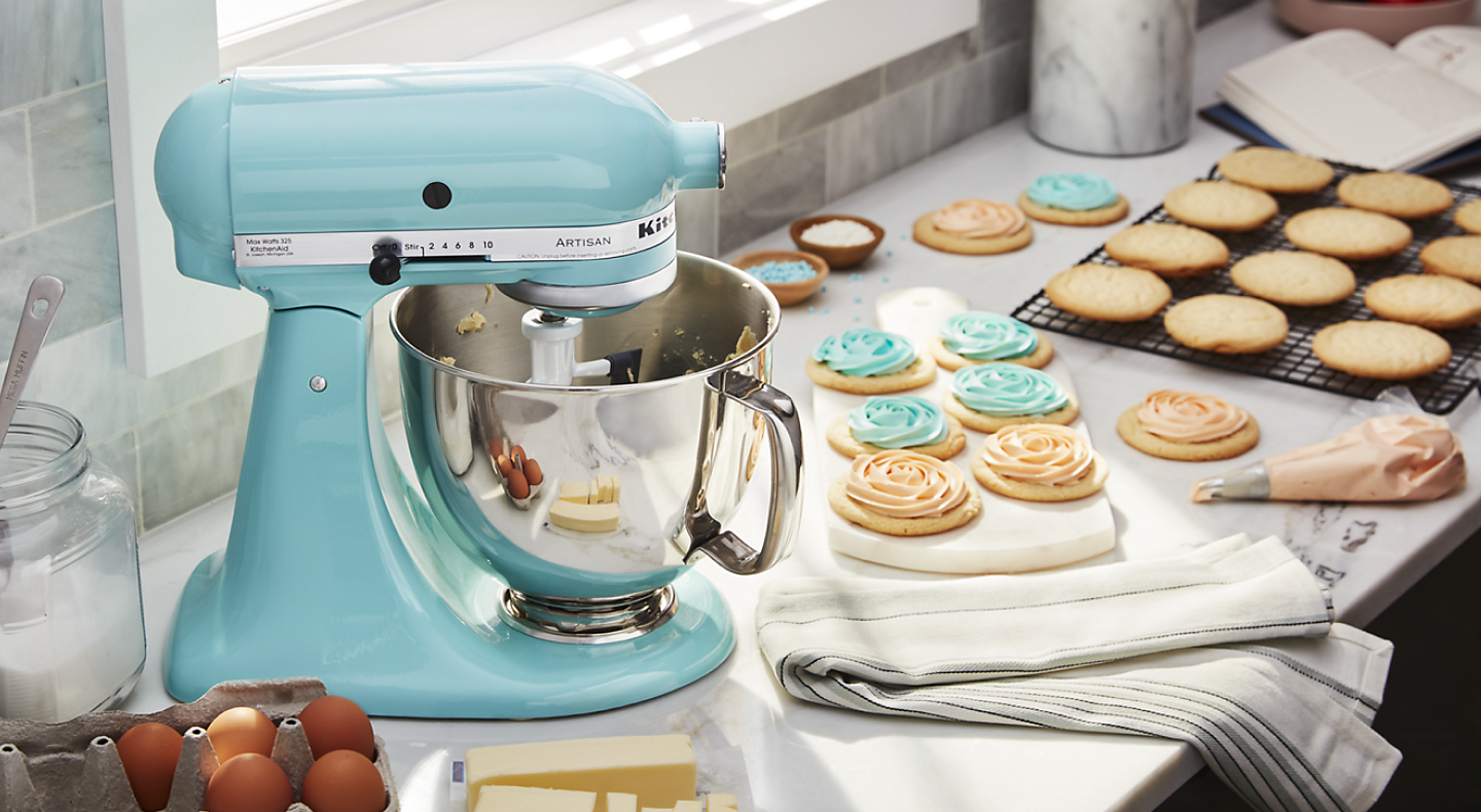 KitchenAid brand stand mixer mixing frosting for sugar cookies