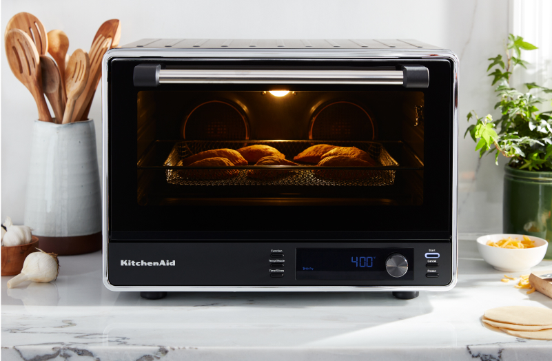A KitchenAid® countertop oven with an air fry basket.