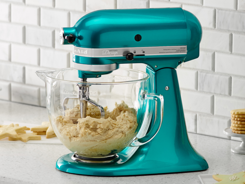 A blue stand mixer with transparent bowl