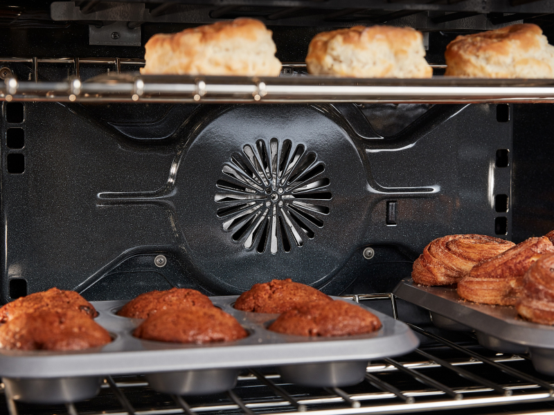 A convection fan pushing air to bake food 