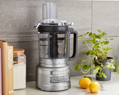 A stainless steel KitchenAid® food processor on a countertop