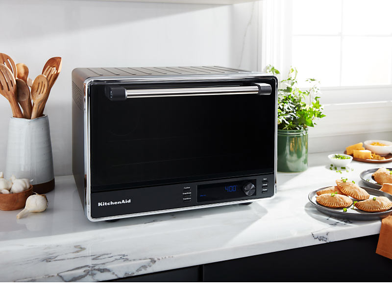 A KitchenAid® countertop oven with an air fry basket