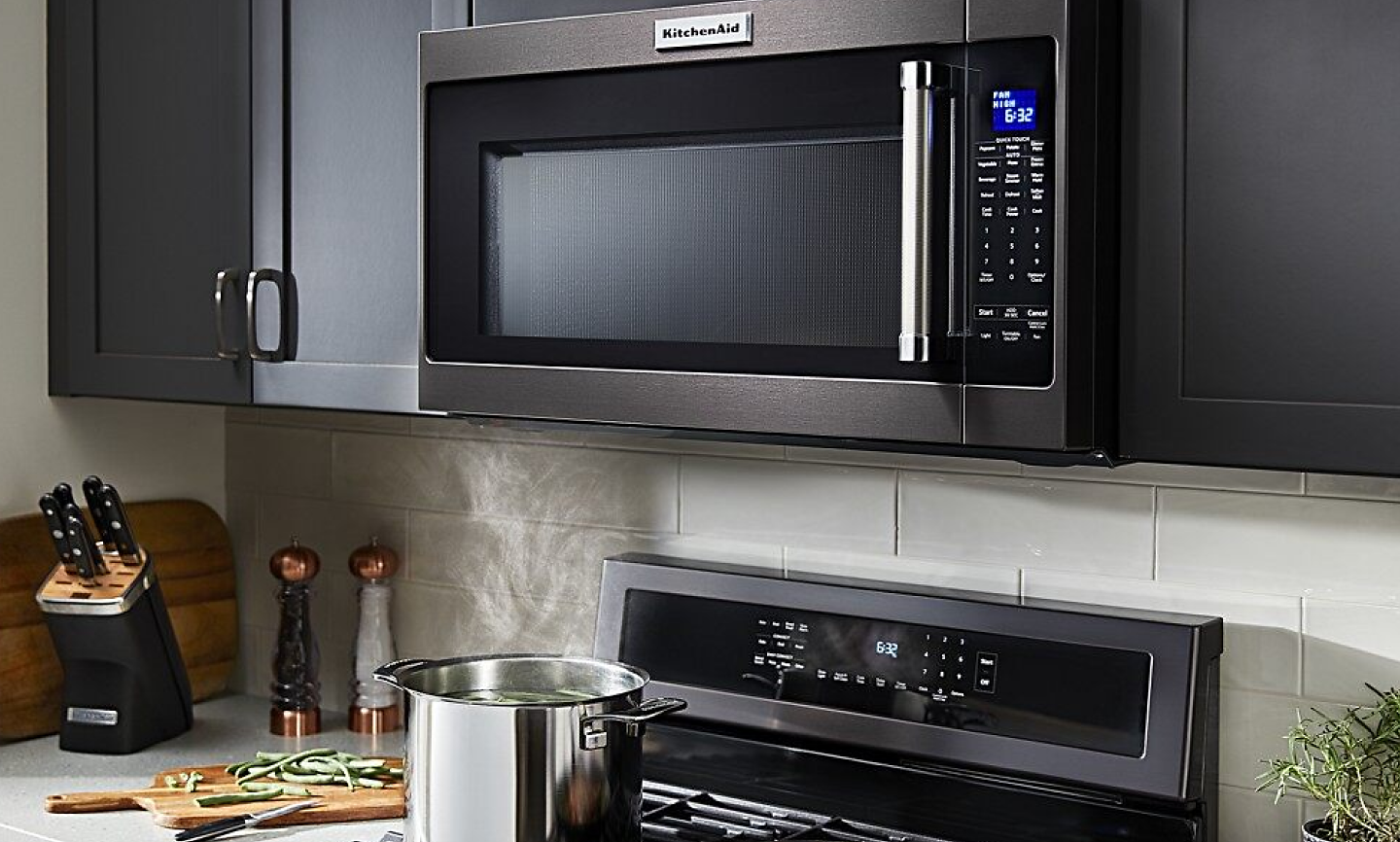 KitchenAid® microwave-hood combination installed above a gas range