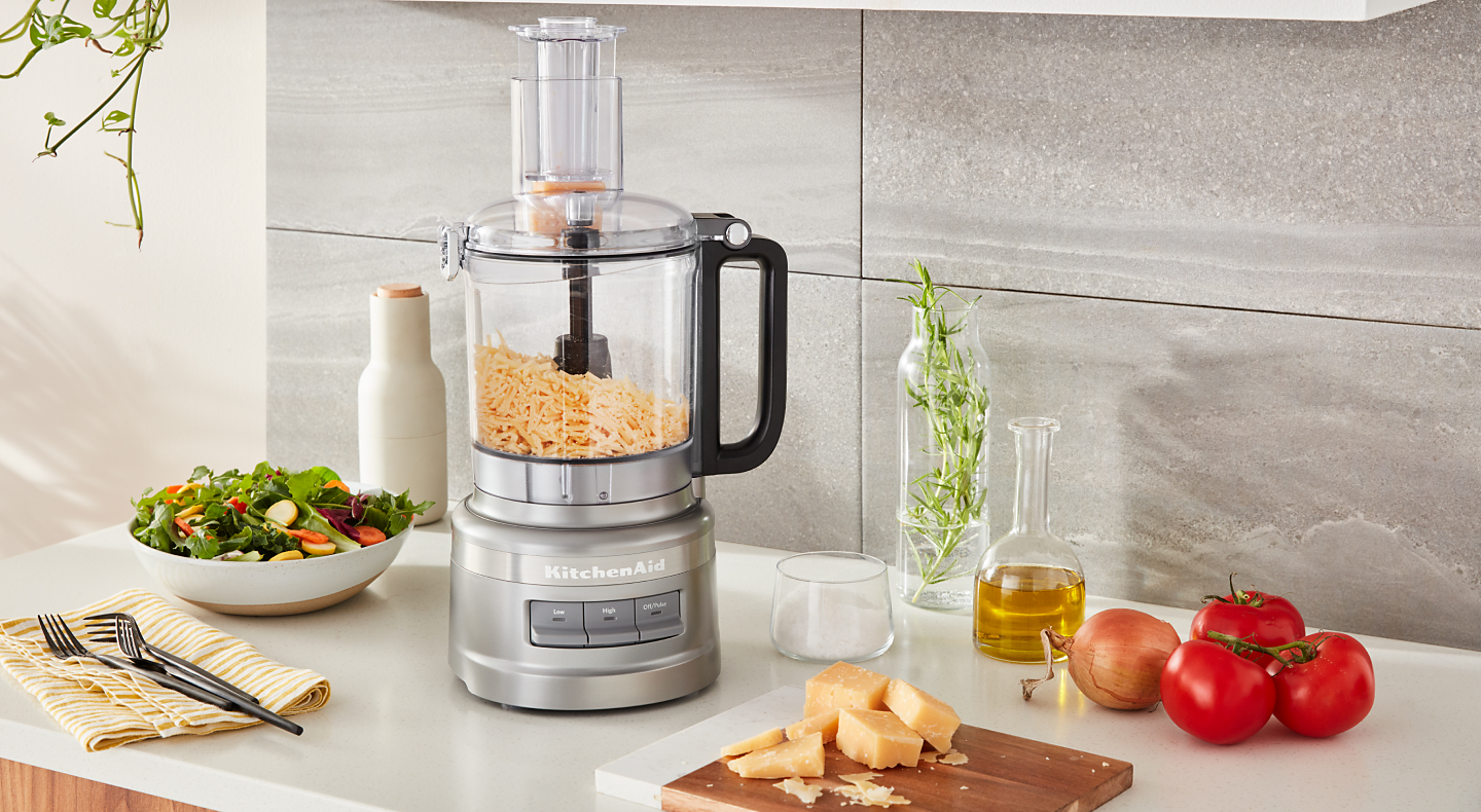 https://kitchenaid-h.assetsadobe.com/is/image/content/dam/business-unit/kitchenaid/en-us/marketing-content/site-assets/page-content/blog/how-to-grate-cheese-in-a-food-processor/how-to-grate-cheese_2-Desktop.jpg?fmt=png-alpha&qlt=85,0&resMode=sharp2&op_usm=1.75,0.3,2,0&scl=1&constrain=fit,1