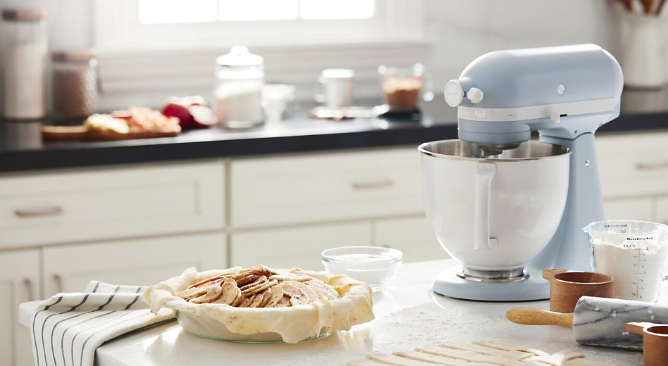 Stand mixer with homemade pie crust and apple pie