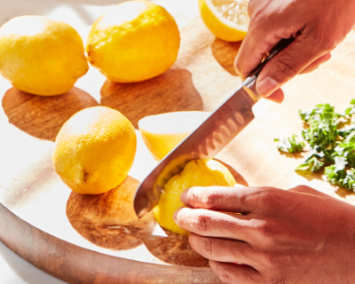 A person peeling lemons.