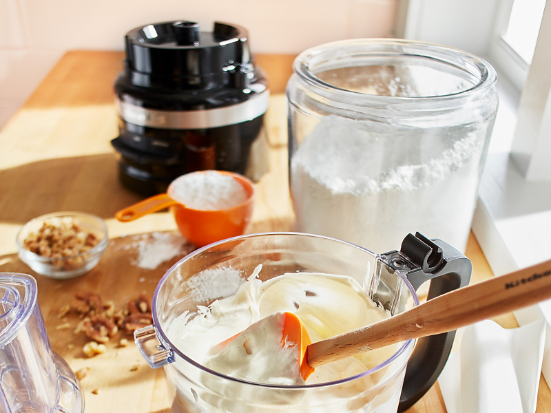 Cake ingredients on countertop with KitchenAid® food processor