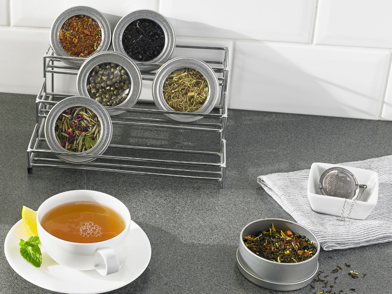 Hot tea and various loose tea leaves