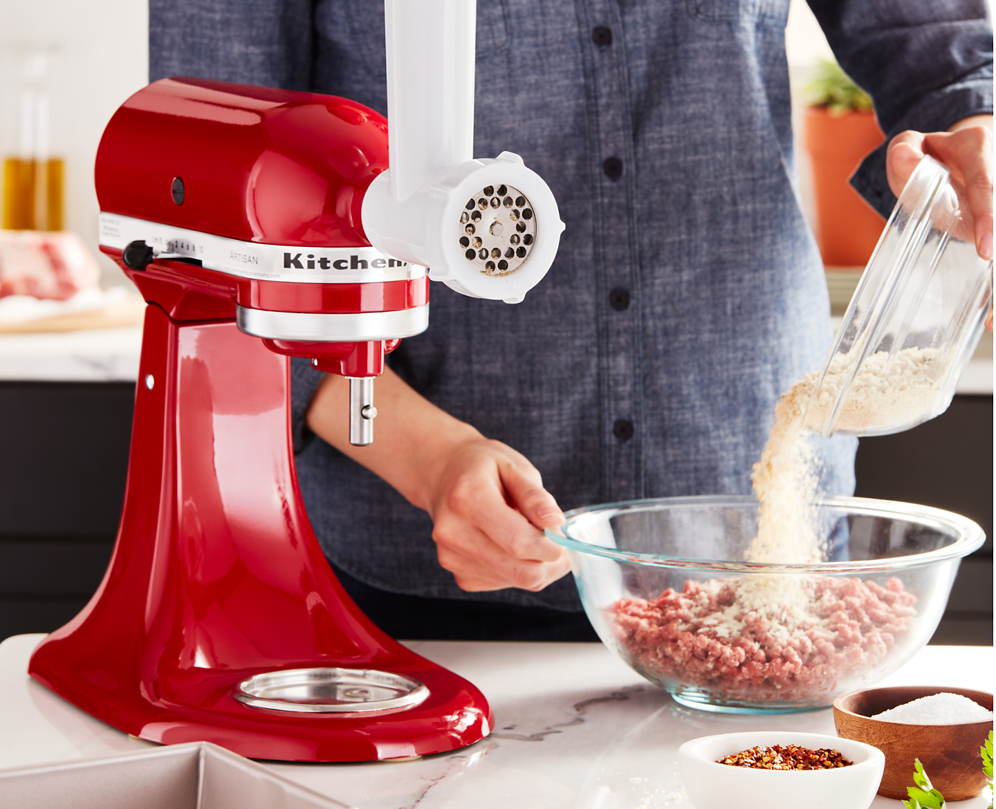 Red KitchenAid® stand mixer with Meat Grinder Attachment