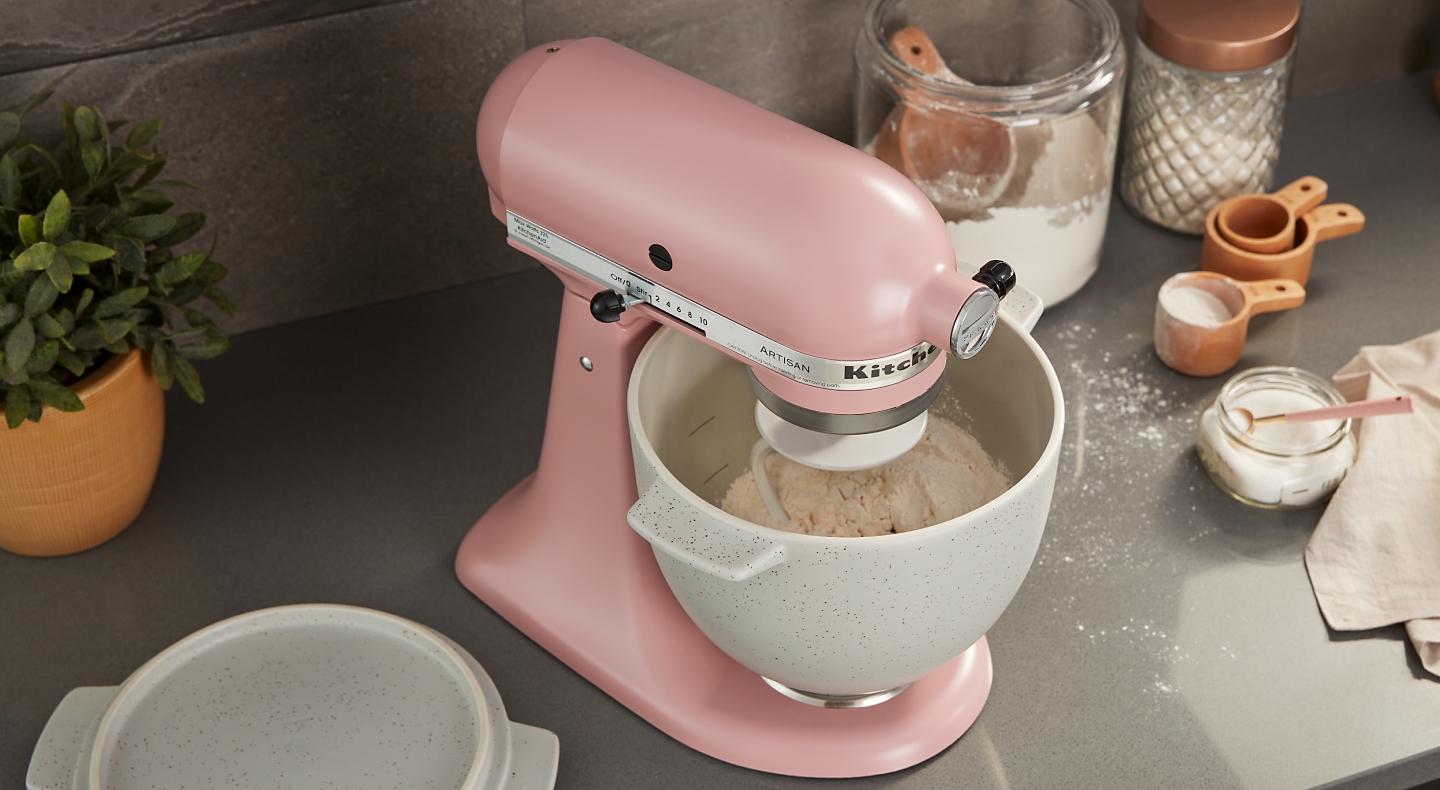 Pink KitchenAid® stand mixer with rice dough in stainless steel bowl