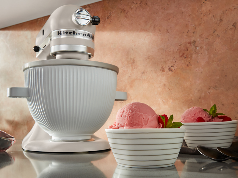 KitchenAid® stand mixer on countertop with two bowls of ice cream