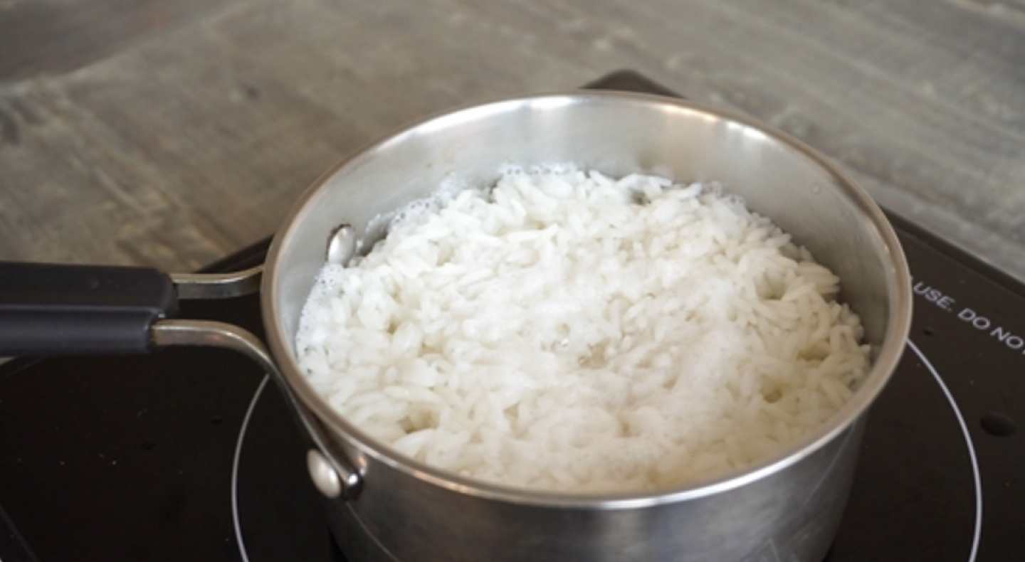A bowl of rice on a hotpad