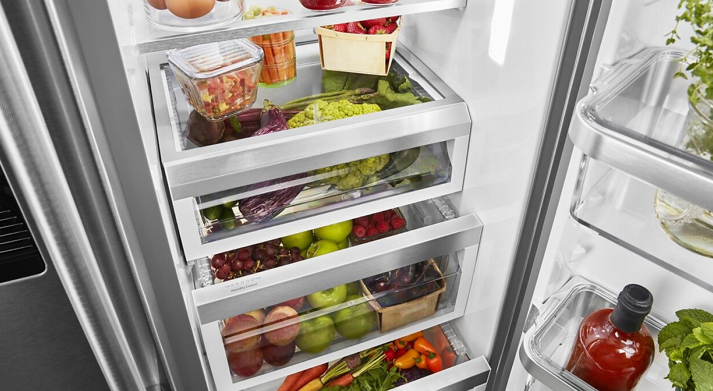 A refrigerator filled with salsa ingredients and other fresh foods