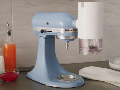 A KitchenAid® stand mixer with Shave Ice Attachment