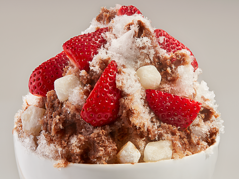 A mound of chocolate strawberry shave ice