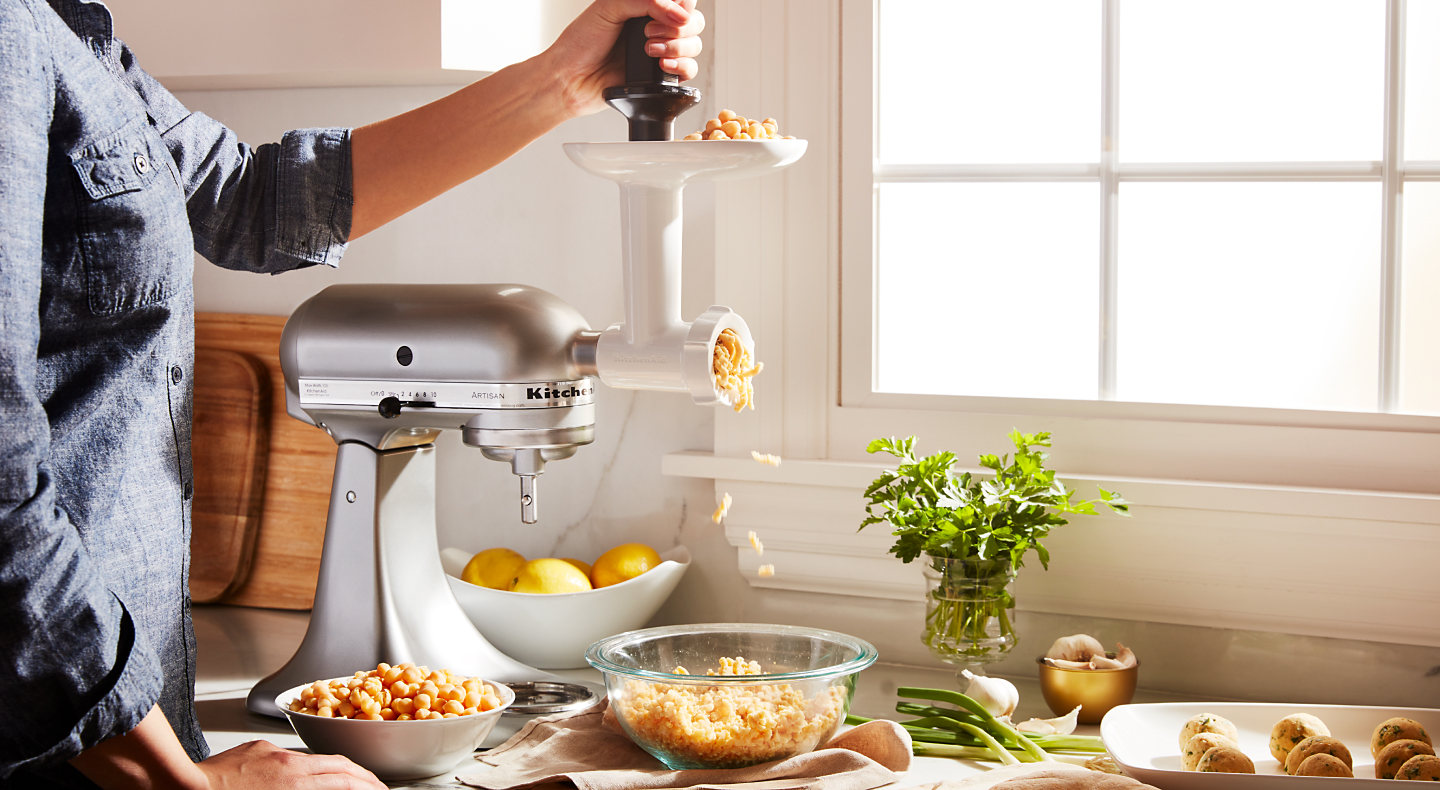 Vegetarian “meatball” mixture coming out of KitchenAid® food grinder attachment