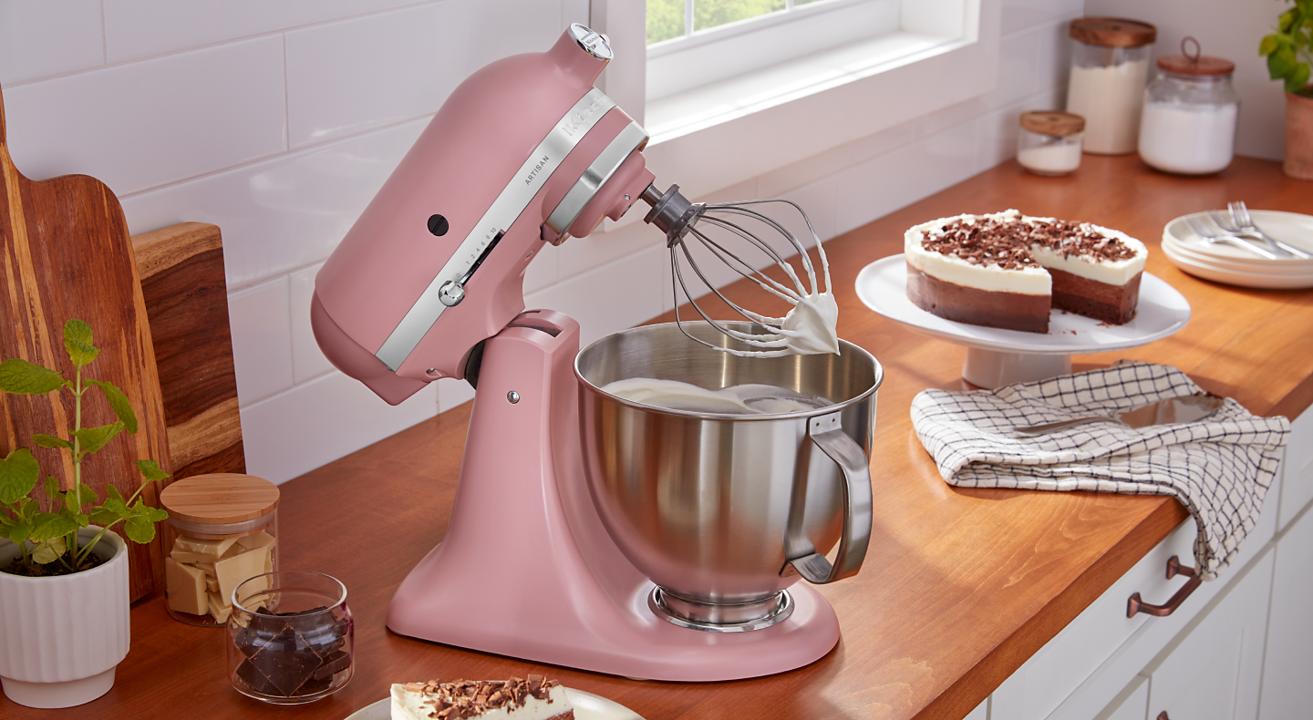 Homemade whipped cream in a pink KitchenAid® stand mixer