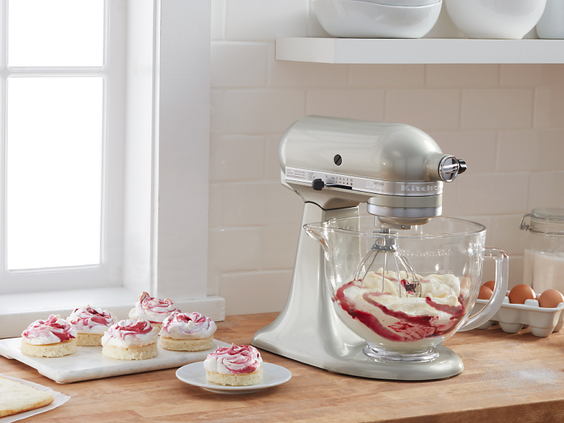 KitchenAid® stand mixer mixing whipped cream with fruit sauce