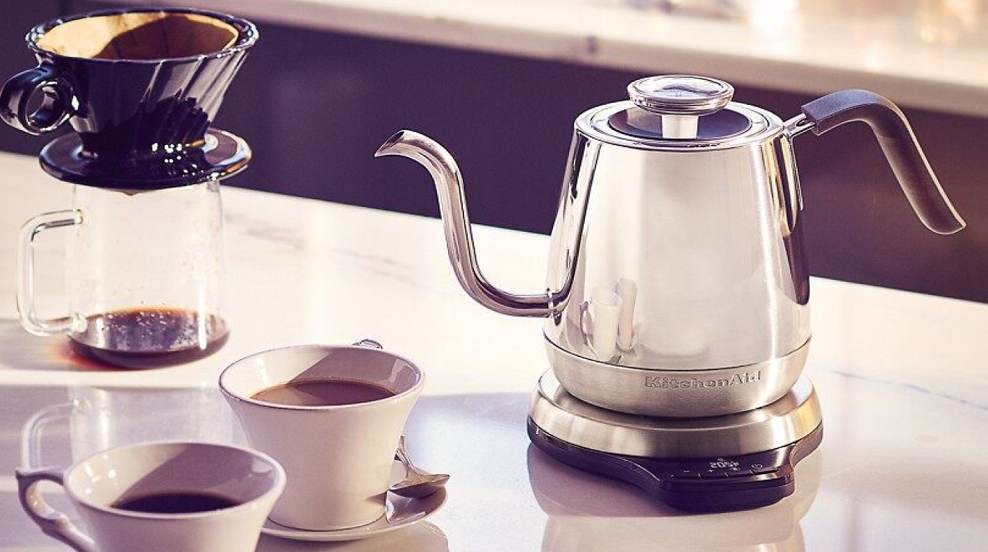 Gooseneck electric kettle on counter with pour over coffee setup Gooseneck electric kettle on counter with pour over coffee setup