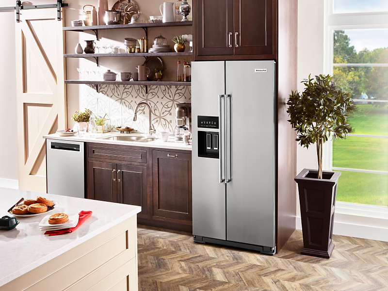 A stainless steel KitchenAid® French Door Refrigerator in a rustic kitchen